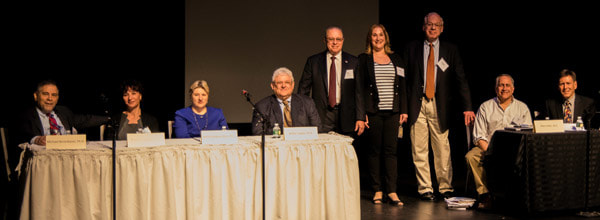 A group of people standing at a table.