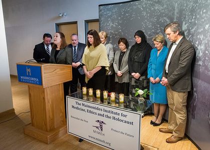 A group of people standing in front of a podium.