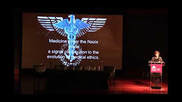 A large screen with an image of the medical symbol.